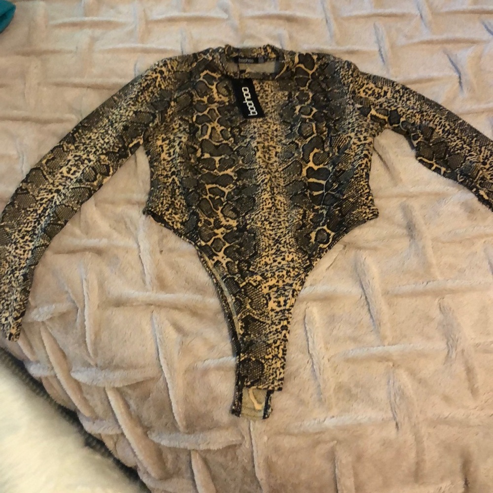Leopard/cheetah print bodysuit. Never worn.